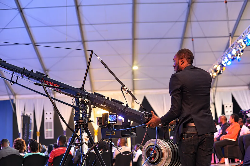 Cosmic Media operator working with production equipment at a live event